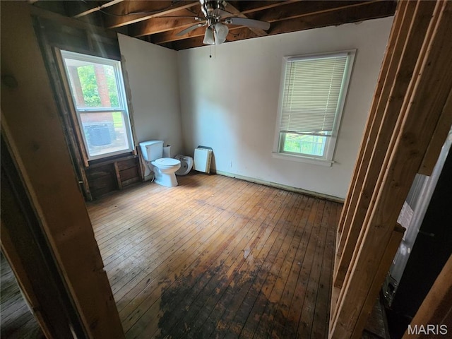 3309 Calvert Ave, Breckenridge Hills, MO 63114 - unfurnished bedroom with wood-type flooring and multiple windows