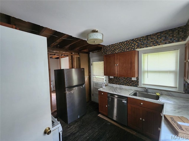 3309 Calvert Ave, Breckenridge Hills, MO 63114 - kitchen with appliances with stainless steel finishes, light countertops, backsplash, and dark wood-style flooring