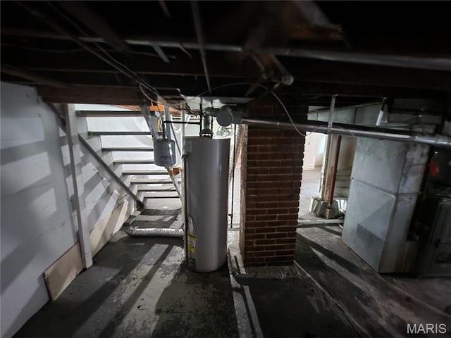 3309 Calvert Ave, Breckenridge Hills, MO 63114 - unfinished below grade area with gas water heater, stairway, and heating unit