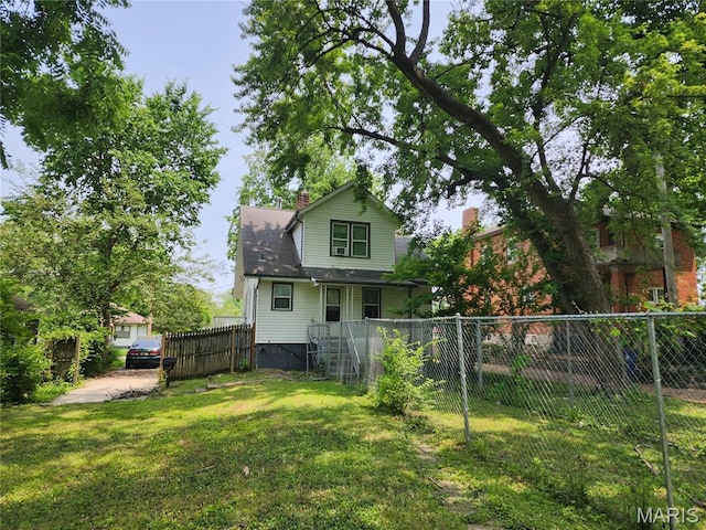 3309 Calvert Ave, Breckenridge Hills, MO 63114 - rear view of house with a chimney