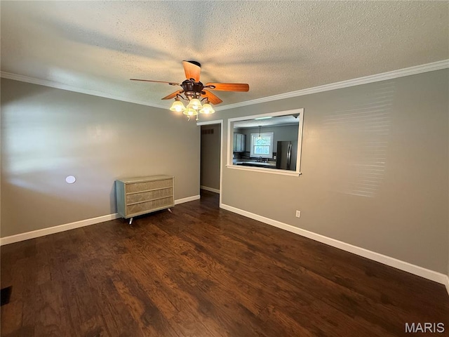 812 Sommerset Dr, Troy, MO 63379 - unfurnished room with crown molding, a ceiling fan, a textured ceiling, and wood finished floors