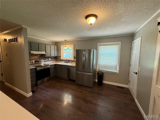 812 Sommerset Dr, Troy, MO 63379 - kitchen with appliances with stainless steel finishes, gray cabinetry, ornamental molding, light countertops, and dark wood-style floors