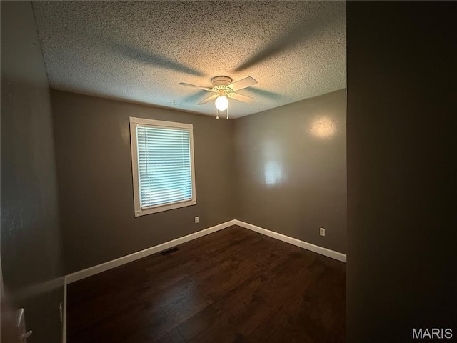 812 Sommerset Dr, Troy, MO 63379 - empty room featuring a textured ceiling, ceiling fan, and dark wood-style floors