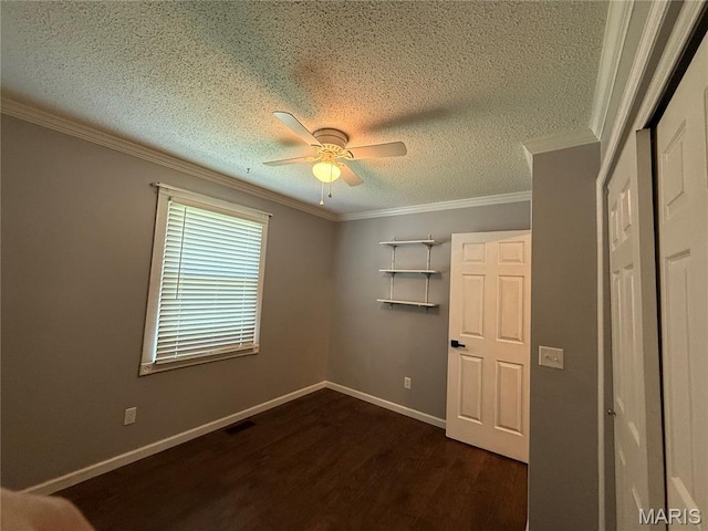 812 Sommerset Dr, Troy, MO 63379 - unfurnished bedroom with dark wood-style floors, a textured ceiling, crown molding, and ceiling fan