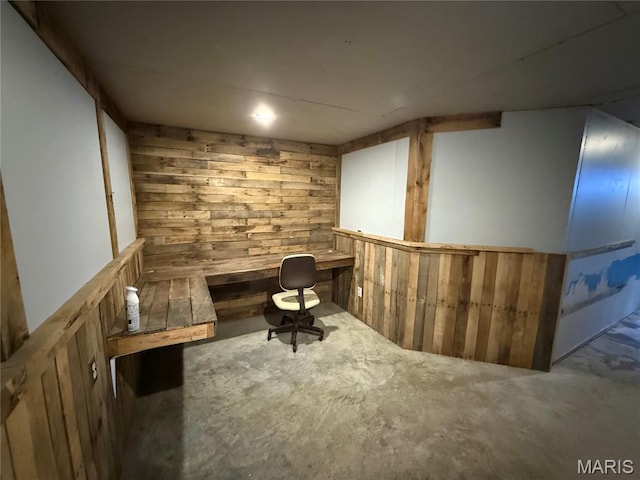 812 Sommerset Dr, Troy, MO 63379 - home office featuring wooden walls and concrete floors