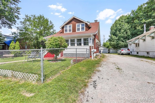 125 N 41st St, Belleville, IL 62226 - view of front facade with a chimney and an outbuilding