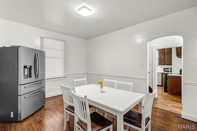 125 N 41st St, Belleville, IL 62226 - dining room featuring dark wood-style flooring and arched walkways