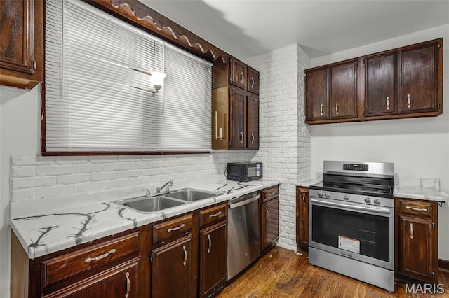 125 N 41st St, Belleville, IL 62226 - kitchen featuring appliances with stainless steel finishes, dark wood-style flooring, and dark brown cabinetry
