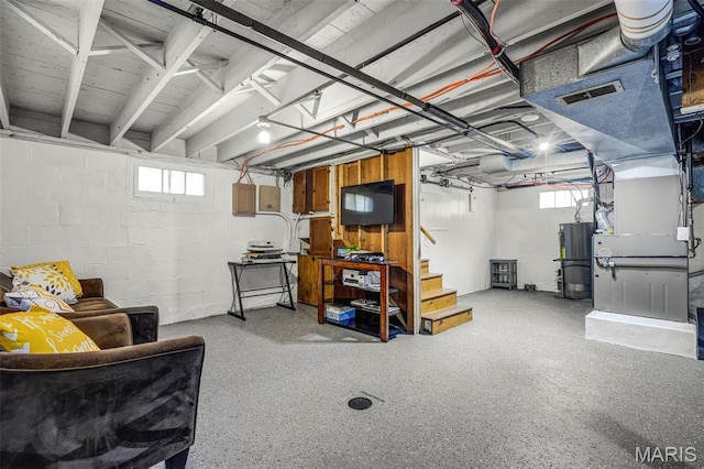 125 N 41st St, Belleville, IL 62226 - below grade area featuring gas water heater, stairs, concrete block wall, and heating unit
