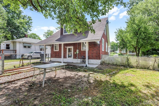 125 N 41st St, Belleville, IL 62226 - back of house featuring brick siding, a shingled roof, and a porch