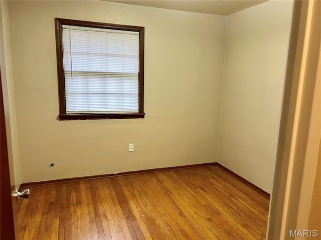 76 Cheshire Dr, Belleville, IL 62223 - spare room featuring hardwood / wood-style floors and baseboards