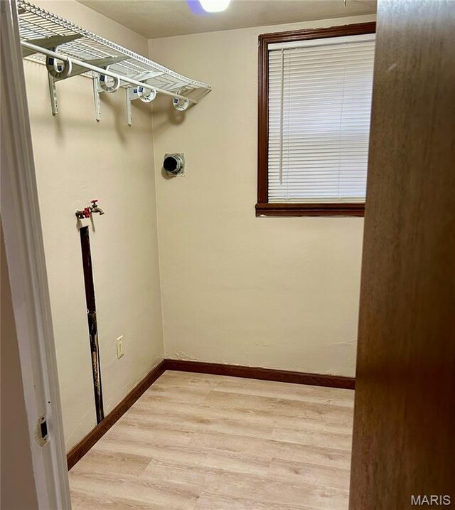 76 Cheshire Dr, Belleville, IL 62223 - laundry area with light wood finished floors and hookup for an electric dryer
