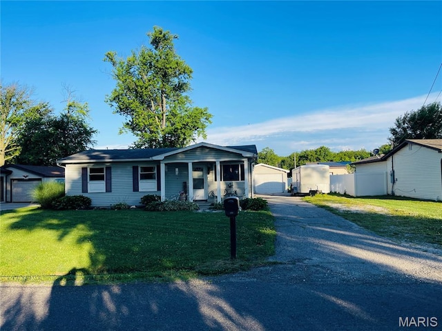15315 Humbert Rd, Brighton, IL 62012 - ranch-style house featuring a front lawn and an outdoor structure