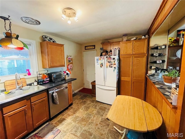 15315 Humbert Rd, Brighton, IL 62012 - kitchen with freestanding refrigerator, dishwasher, stone finish flooring, and brown cabinetry