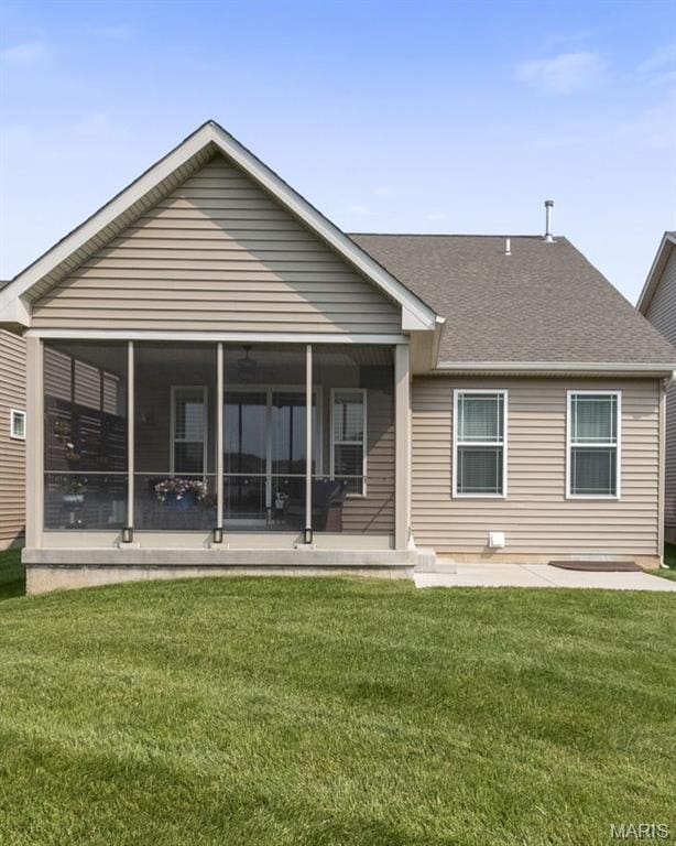 2393 Windswept Farms Dr, Eureka, MO 63025 - rear view of house featuring a sunroom, a yard, and a shingled roof