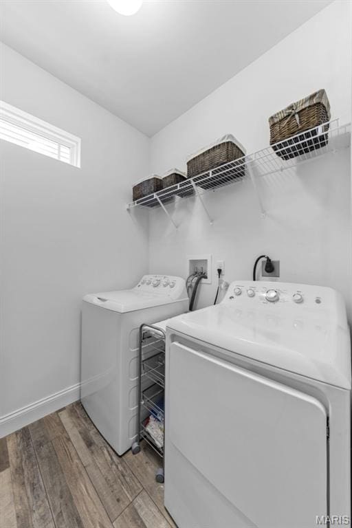 2393 Windswept Farms Dr, Eureka, MO 63025 - laundry room with independent washer and dryer and light wood-type flooring