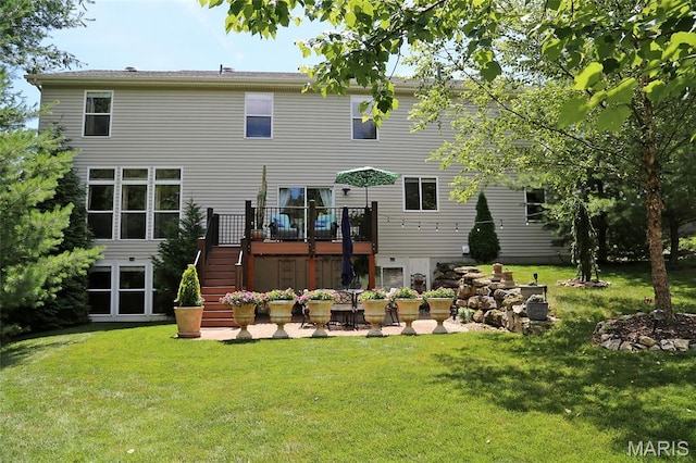27 Carlton Lake Ct, Wentzville, MO 63385 - back of property featuring stairs, a wooden deck, a patio area, and a yard