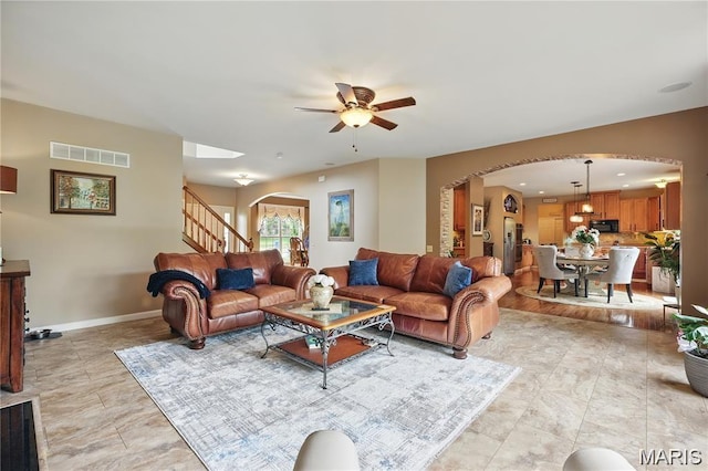 27 Carlton Lake Ct, Wentzville, MO 63385 - living room with arched walkways and ceiling fan