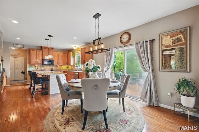27 Carlton Lake Ct, Wentzville, MO 63385 - dining area with light wood-style flooring and recessed lighting