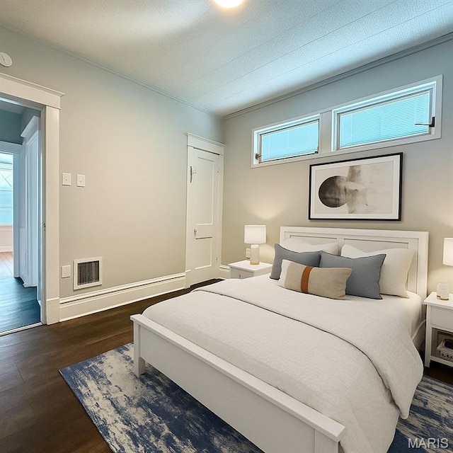4707 Primm St, Saint Louis, MO 63116 - bedroom with dark wood-style flooring