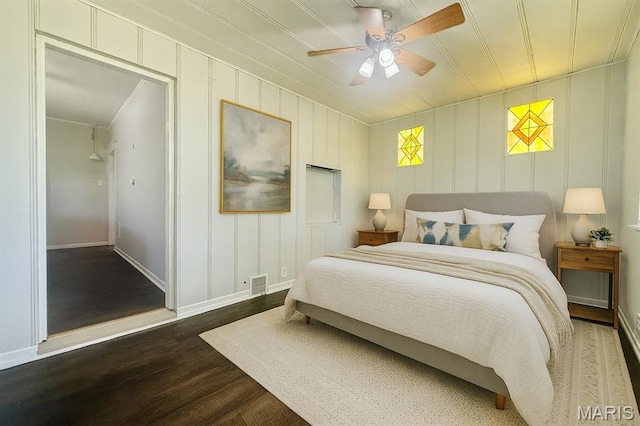 4707 Primm St, Saint Louis, MO 63116 - bedroom with wood finished floors, a ceiling fan, and a decorative wall
