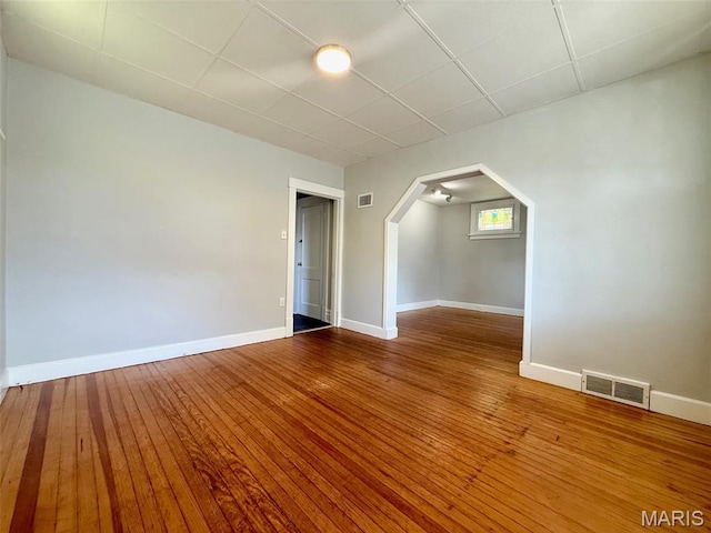 4707 Primm St, Saint Louis, MO 63116 - additional living space with arched walkways and hardwood / wood-style flooring
