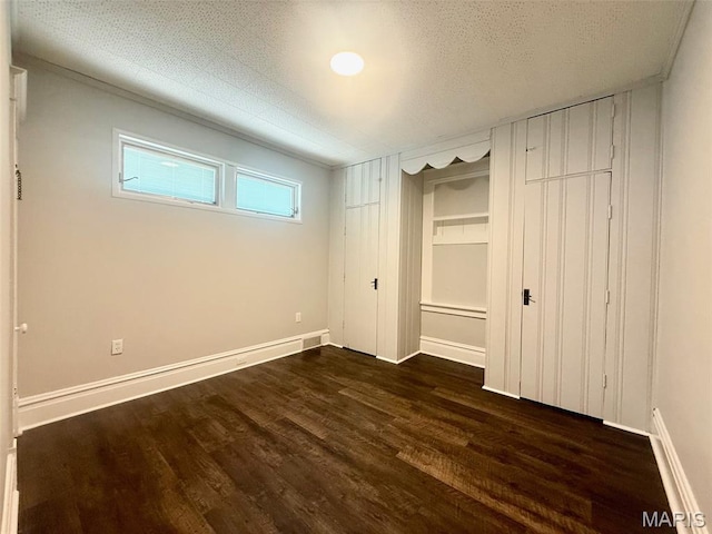 4707 Primm St, Saint Louis, MO 63116 - unfurnished bedroom featuring wood finished floors and baseboards