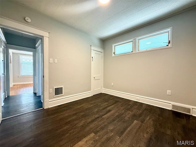 4707 Primm St, Saint Louis, MO 63116 - unfurnished bedroom with wood finished floors and baseboards