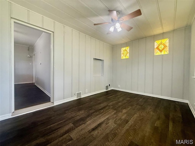 4707 Primm St, Saint Louis, MO 63116 - empty room featuring a ceiling fan and dark wood-type flooring