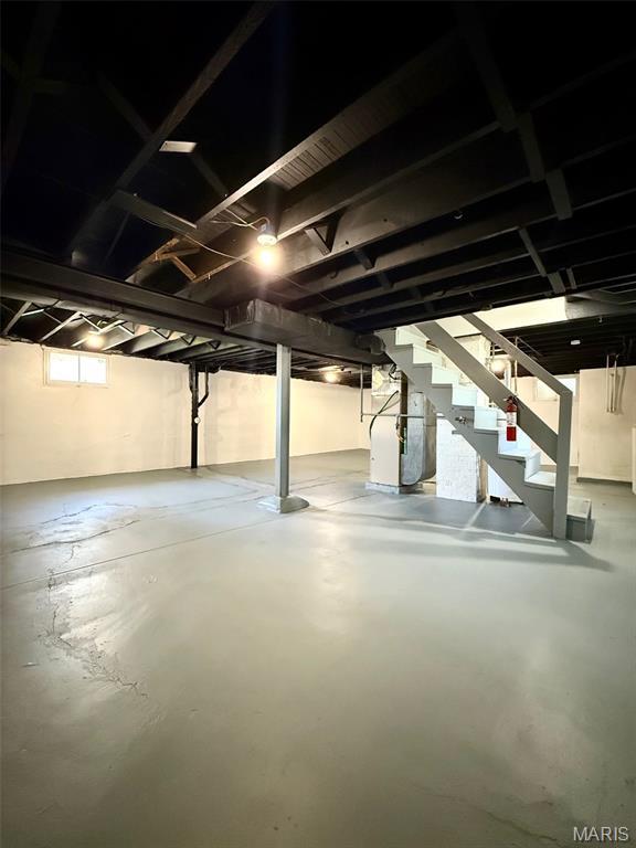 4707 Primm St, Saint Louis, MO 63116 - basement with stairs and heating unit