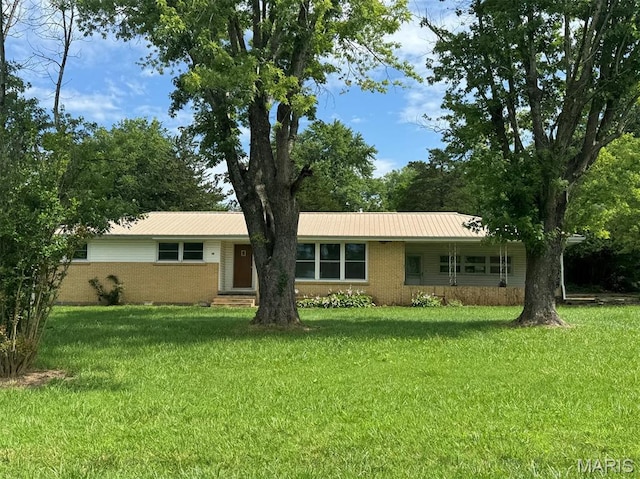 48 E N Ave, Ellsinore, MO 63937 - single story home with a front lawn, a metal roof, brick siding, and entry steps