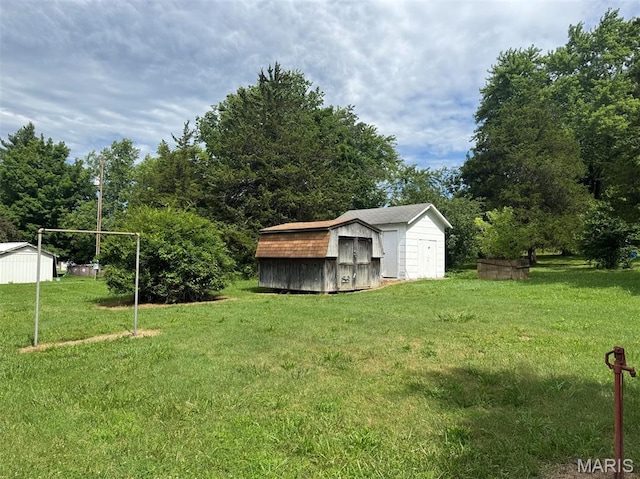 48 E N Ave, Ellsinore, MO 63937 - view of grassy yard with a storage shed