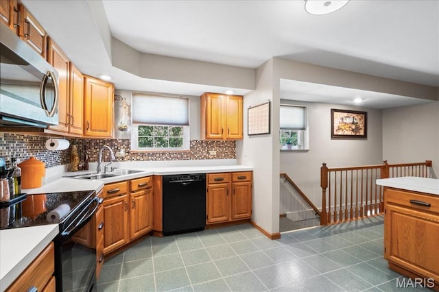 8822 Crest Oak Ln, Saint Louis, MO 63126 - kitchen featuring black appliances, backsplash, and light countertops