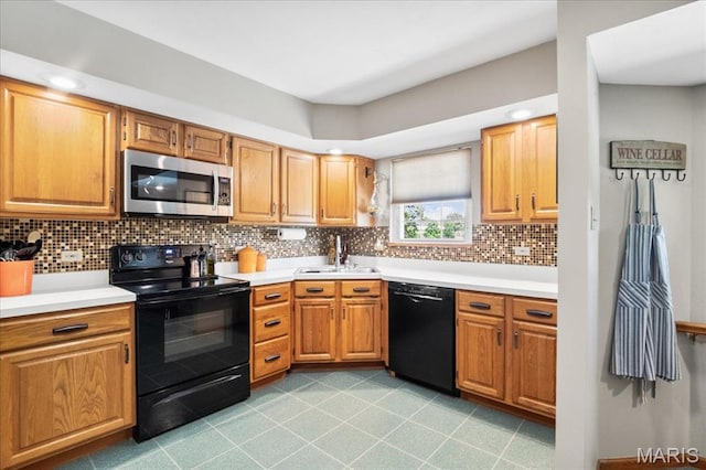 8822 Crest Oak Ln, Saint Louis, MO 63126 - kitchen featuring black appliances, tasteful backsplash, light countertops, and light tile patterned flooring