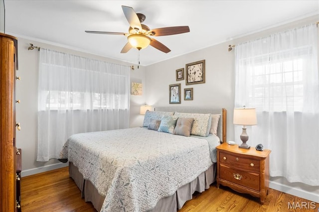 8822 Crest Oak Ln, Saint Louis, MO 63126 - bedroom featuring light wood-style floors, ornamental molding, and a ceiling fan