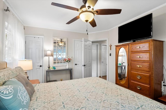 8822 Crest Oak Ln, Saint Louis, MO 63126 - bedroom with multiple closets, ornamental molding, and ceiling fan