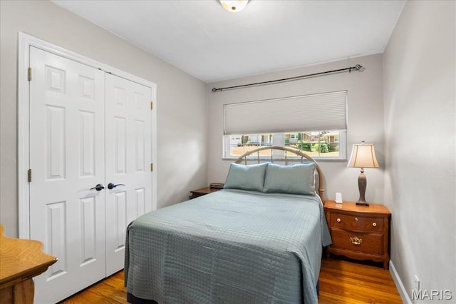 8822 Crest Oak Ln, Saint Louis, MO 63126 - bedroom featuring wood finished floors and a closet