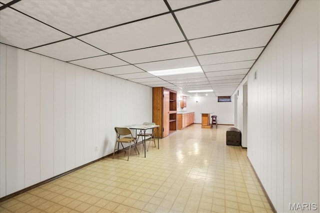8822 Crest Oak Ln, Saint Louis, MO 63126 - finished below grade area with light flooring, a paneled ceiling, and wood walls