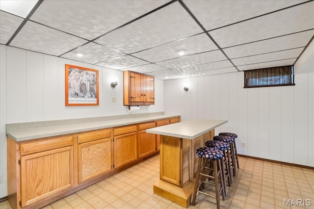 8822 Crest Oak Ln, Saint Louis, MO 63126 - indoor dry bar featuring a drop ceiling and light flooring