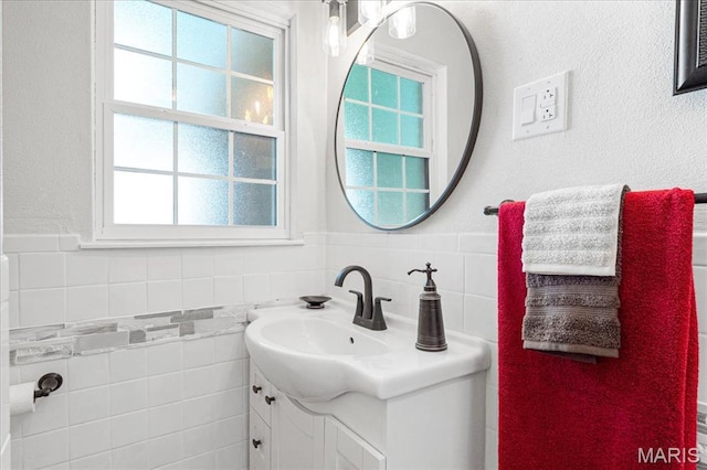 407 N 28th St, Belleville, IL 62226 - bathroom featuring vanity, tile walls, and wainscoting