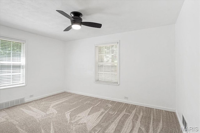 407 N 28th St, Belleville, IL 62226 - carpeted spare room with healthy amount of natural light and ceiling fan
