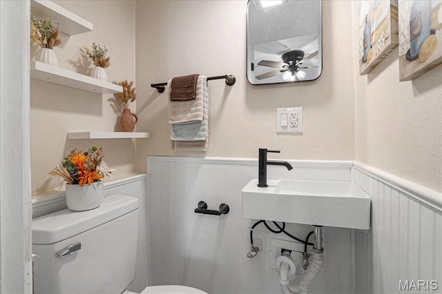407 N 28th St, Belleville, IL 62226 - half bath with a wainscoted wall and ceiling fan