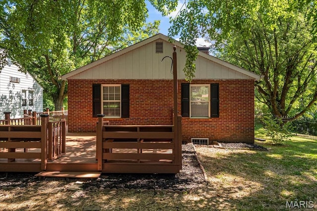 407 N 28th St, Belleville, IL 62226 - back of property featuring brick siding, a wooden deck, and a yard