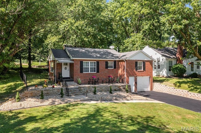 407 N 28th St, Belleville, IL 62226 - single story home with driveway, brick siding, and a garage