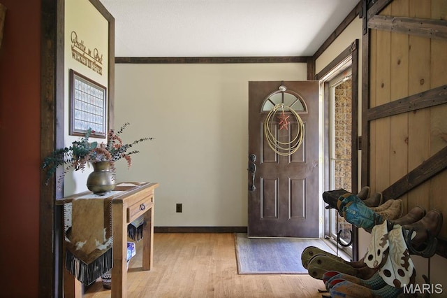 31337 Hudson Rd, Lebanon, MO 65536 - foyer with wood finished floors and a barn door