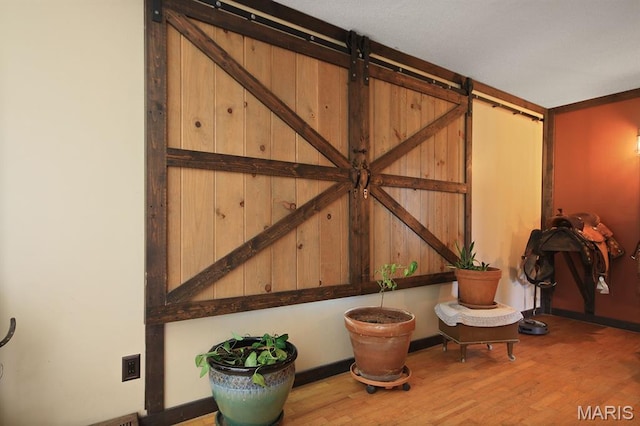 31337 Hudson Rd, Lebanon, MO 65536 - detailed view of a barn door and wood finished floors