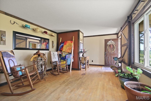 31337 Hudson Rd, Lebanon, MO 65536 - sitting room featuring wood finished floors and crown molding