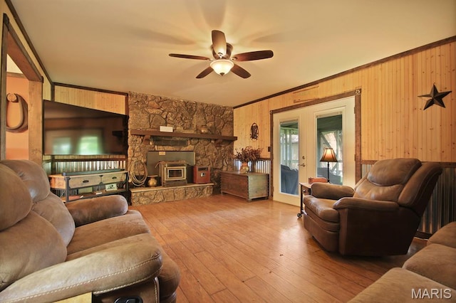 31337 Hudson Rd, Lebanon, MO 65536 - living area featuring a ceiling fan, wooden walls, hardwood / wood-style floors, and ornamental molding