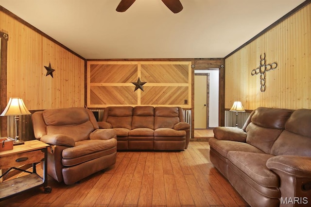31337 Hudson Rd, Lebanon, MO 65536 - living room featuring wood walls, a ceiling fan, and wood-type flooring