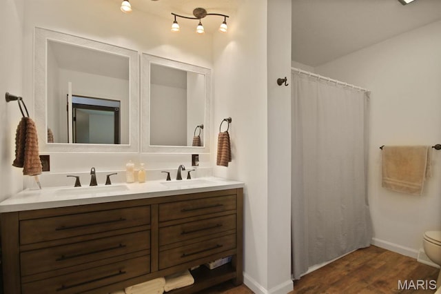 31337 Hudson Rd, Lebanon, MO 65536 - full bath featuring double vanity, wood finished floors, and curtained shower